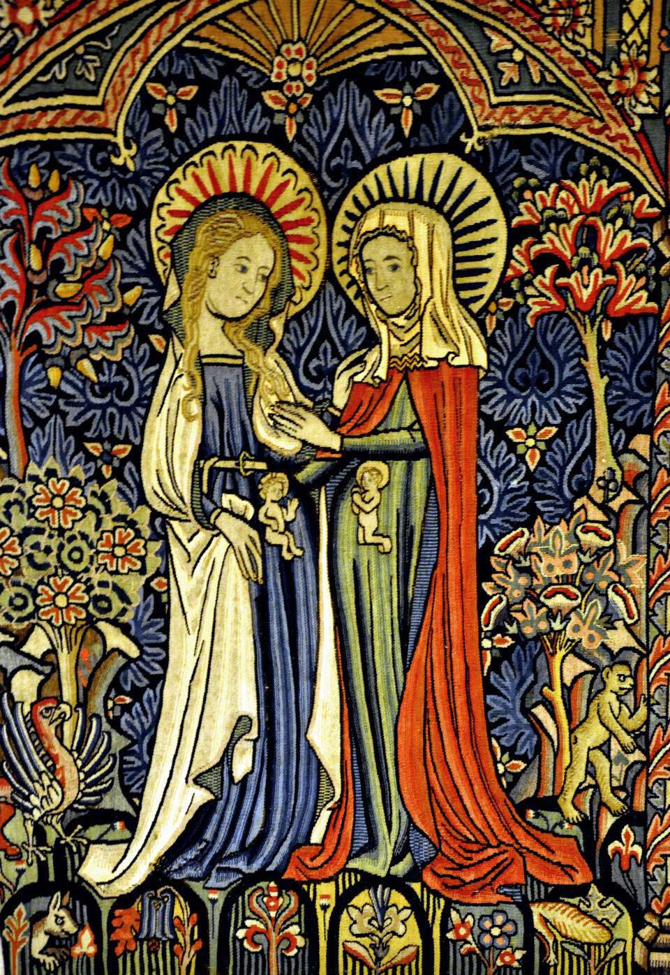 Dette franske veggteppet fra rundt 1410 viser døperen Johannes som kneler for Jesusbarnet i magen til Maria.