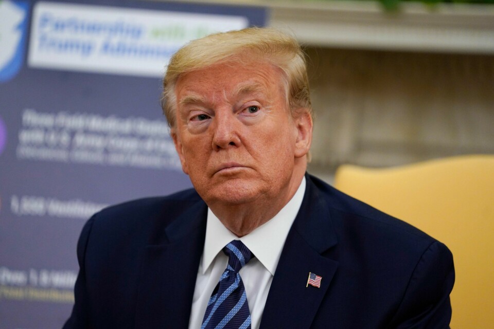 President Donald Trump listens during a meeting about the coronavirus response with Gov. Phil Murphy, D-N.J., in the Oval Office of the White House, Thursday, April 30, 2020, in Washington. (AP Photo/Evan Vucci)