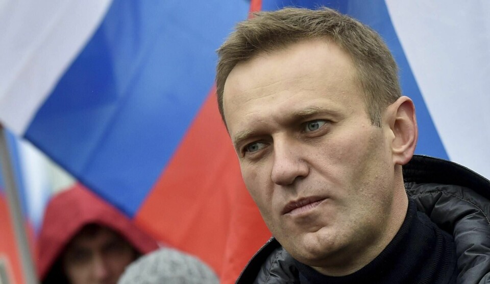 Putin-kritiker Aleksej Navalnyj ble satt i husarrest i 2014. Menneskerettsdomstolen i Strasbourg har konkludert med at Russland brøt menneskerettighetene med arresten. FILE In this file photo taken on Sunday, Feb. 24, 2019, Russian opposition activist Alexei Navalny takes part in a march in memory of opposition leader Boris Nemtsov in Moscow, Russia .The European Court of Human Rights has ruled that a Russian court order placing opposition leader Alexei Navalny under house arrest in 2014 was unlawful and politically driven.(AP Photo/Dmitry Serebryakov, File)