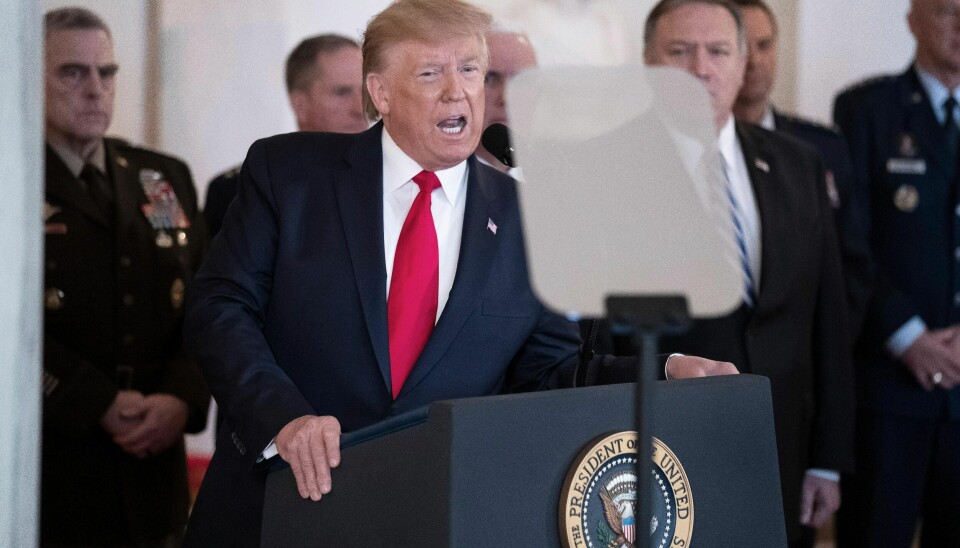 President Donald Trump addresses the nation from the White House on the ballistic missile strike that Iran launched against Iraqi air bases housing U.S. troops, Wednesday, Jan. 8, 2020, in Washington, accompanied by Vice President Mike Pence, Secretary of State Mike Pompeo, and others. (AP Photo/Alex Brandon)