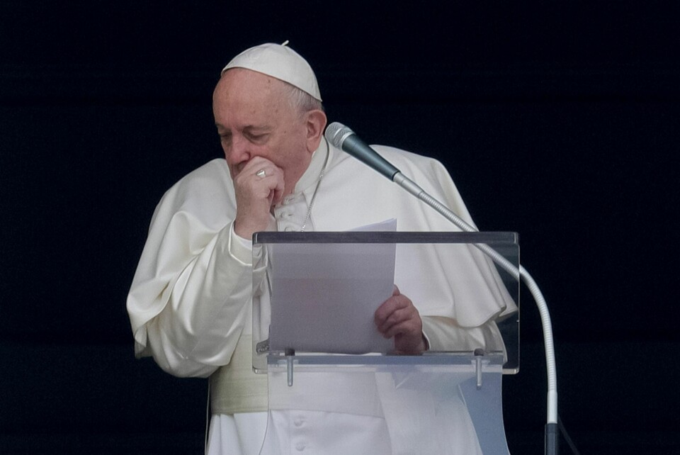 Pope Francis coughs during the Angelus noon prayer he recited from the window of his studio overlooking St. Peter's Square, at the Vatican, Sunday, March 1, 2020. A coughing Pope Francis told pilgrims gathered for the traditional Sunday blessing that he is canceling his participation at a week-long spiritual retreat in the Roman countryside because of a cold. It is the first time in his seven-year papacy that he has missed the spiritual exercises that he initiated early in his pontificate to mark the start of each Lenten season. (AP Photo/Andrew Medichini)