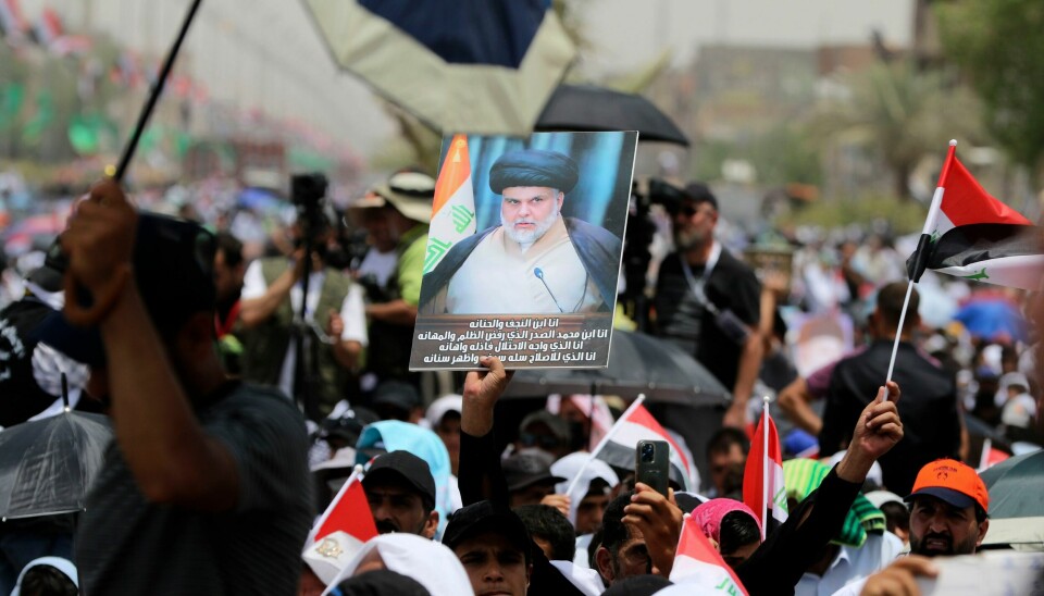 IRAK: Flere hundre tusen tilhengere av den mektige sjialederen Muqtada al-Sadr demonstrerte fredag i Bagdad-forstaden som er oppkalt etter ham, Sadr-byen. Flere hundre tusen tilhengere av den mektige sjialederen Muqtada al-Sadr demonstrerte fredag i Bagdad-forstaden som er oppkalt etter ham, Sadr-byen. Foto: AP / NTB