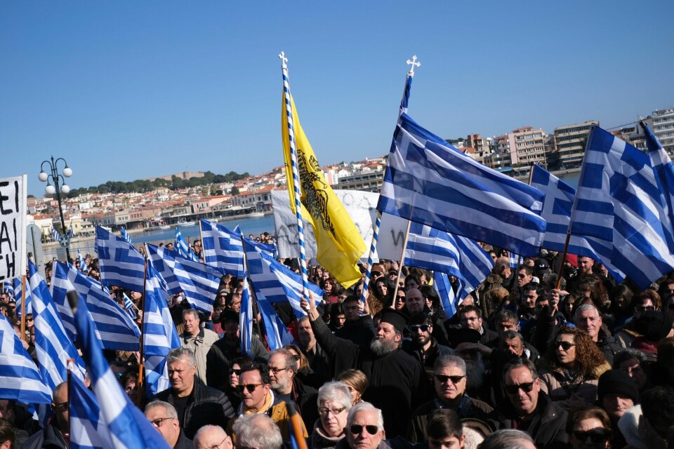 Protesters take part in a rally outside the Municipality of Mytilene, on the northeastern Aegean island of Lesbos, Greece, on Wednesday, Jan. 22, 2020. Local residents and business owners have launched a day of protest on the Greek islands hardest hit by migration, demanding the Greek government ease severe overcrowding at refugee camps. (AP Photo/Aggelos Barai)