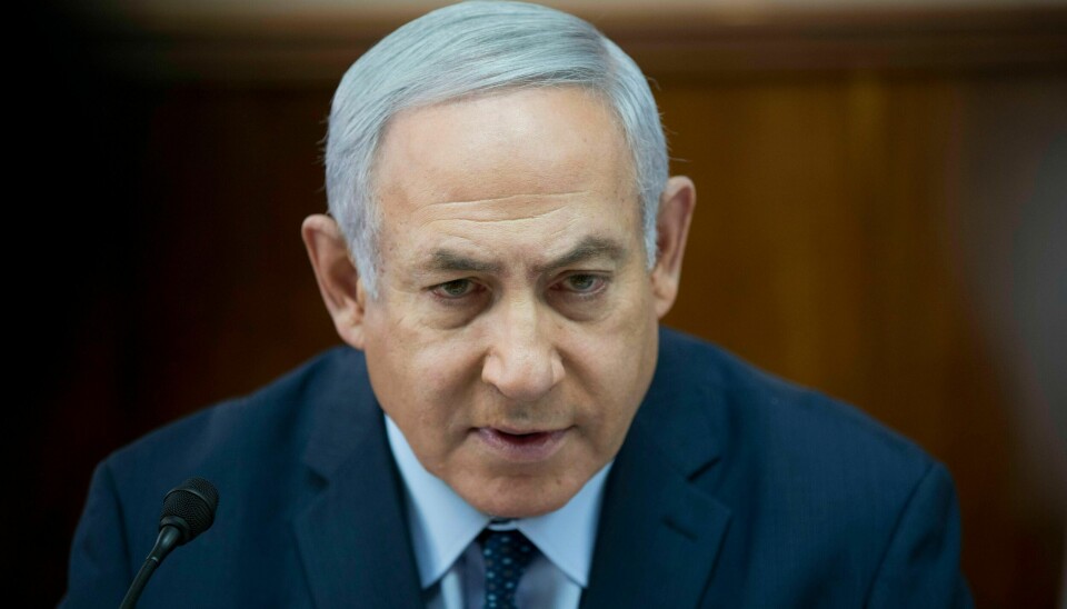 Israeli Prime Minister Benjamin Netanyahu chairs the weekly cabinet meeting at the prime minister's office, in Jerusalem, Sunday, Jan. 27, 2019. (Abir Sultan Pool via AP)
